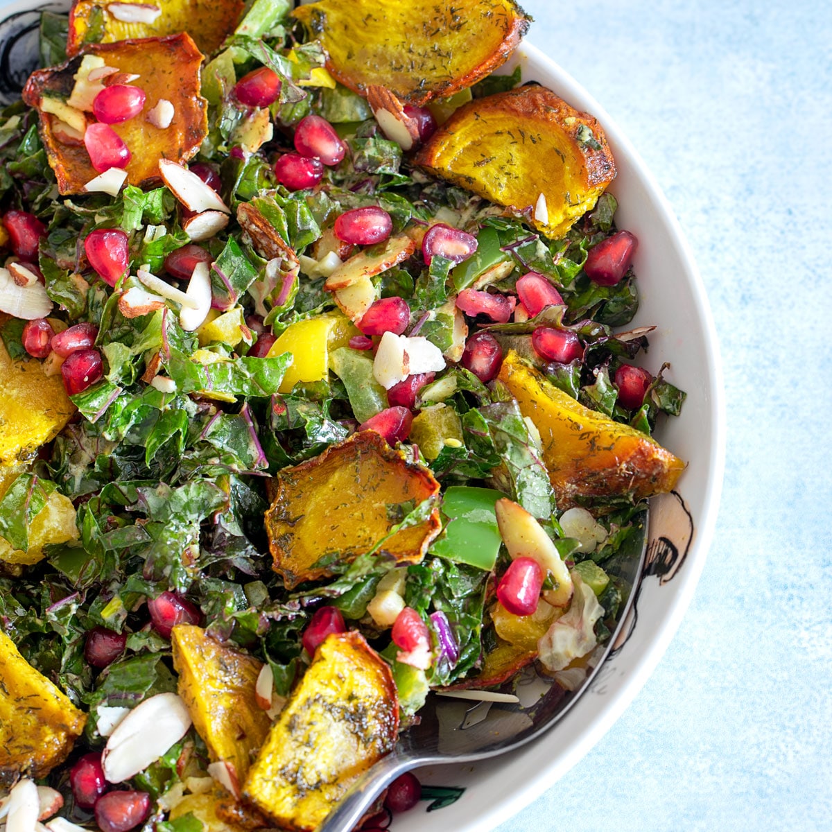 Fall Harvest Beet, Pomegranate, Avocado, and Gouda Kale Salad with Sweet +  Spicy Pepitas